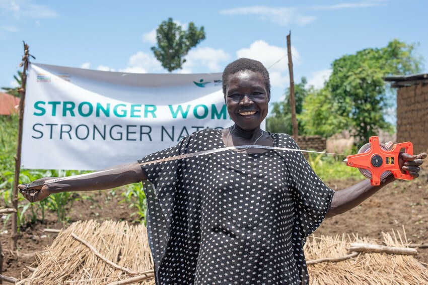 Woman in front of a banner